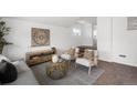 Stylish living room featuring neutral decor, modern furnishings, and carpet, perfect for comfortable living at 461 S Lowell Blvd, Denver, CO 80219