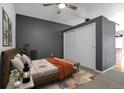 Bedroom featuring modern gray walls, a decorative rug, and a large closet at 1438 Little Raven St # 201, Denver, CO 80202