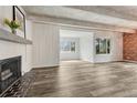 Spacious living room with sleek flooring, modern fireplace, and bright, natural light. Ready to move in! at 2525 S Dayton Way # 2209, Denver, CO 80231