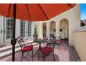 Charming patio area with outdoor seating, a stylish umbrella and decorative landscaping at 100 S University Blvd # 4, Denver, CO 80209