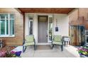 Inviting front porch with seating, decorative planters, and clear address numbers at 1426 S Pearl St, Denver, CO 80210