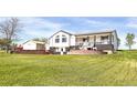 Charming two-story home features well-manicured lawn and beautiful brick accents, offering delightful curb appeal at 18553 County Road 5, Berthoud, CO 80513