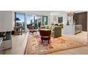 Spacious living room with modern fireplace, rug, and balcony access at 155 Steele St # 418, Denver, CO 80206