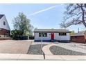 Inviting single-story home with fresh exterior paint, manicured landscaping, and a stone walkway at 8540 Corona St, Denver, CO 80229