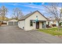 A well-maintained home with detached garage, and a beautifully landscaped front yard at 1055 Quartz St, Golden, CO 80401