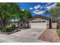 Beautifully maintained one-story home with two-car garage and well-kept front yard landscaping at 4539 E Caley Pl, Centennial, CO 80121