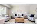 Inviting living room with neutral tones, stylish furniture, and a comfortable seating arrangement at 1757 S Van Dyke Way, Lakewood, CO 80228