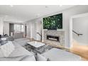 Inviting living room with a modern fireplace, large screen TV, and comfortable sectional sofa at 3103 W 18Th Ave, Denver, CO 80204