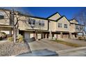 Charming townhome exterior with attached garages, brick accents, and professional landscaping at 1785 Morrison Ct, Superior, CO 80027