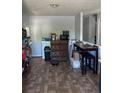 Inviting dining area featuring a built-in cabinet, ample seating, and neutral color scheme at 19645 E Buchanan Pl, Aurora, CO 80011