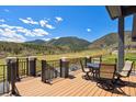 Spacious deck with outdoor furniture overlooking beautiful mountain views and treed valley at 4745 Mesa Top Dr, Monument, CO 80132