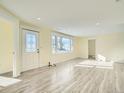Living room with vinyl flooring and large window at 8501 E 104Th Ave, Henderson, CO 80640