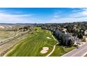 Beautiful aerial view of a residential area next to a golf course under a blue sky at 3383 Mount Royal Dr # 46, Castle Rock, CO 80104