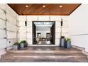 Grand entrance featuring tile flooring, a wooden ceiling, and double doors to the house at 29822 Troutdale Scenic Dr, Evergreen, CO 80439