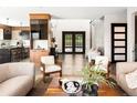 Spacious foyer with an open floor plan, wood floors, and stylish modern decor at 29822 Troutdale Scenic Dr, Evergreen, CO 80439