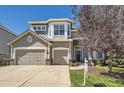 Two-story house with attached garage and landscaping at 10179 Longview Dr, Lone Tree, CO 80124