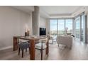 Open-concept living space with modern furniture and expansive windows offering stunning outdoor views at 4200 W 17Th Ave # 508, Denver, CO 80204