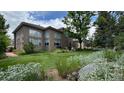 Spacious backyard with lush lawn and landscaping offering a serene outdoor space for relaxation and recreation at 6584 S Sedalia St, Aurora, CO 80016