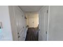 Bright entryway features wood-look floors and access to the rest of the home at 47375 Lilac Ave, Bennett, CO 80102