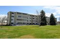 Well-manicured lawn surrounds this charming condominium complex with abundant green space at 9180 E Center Ave # 9D, Denver, CO 80247