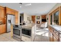 Spacious kitchen boasts a large island, modern appliances, and seamless flow into the cozy living area at 7162 S Fillmore Cir, Centennial, CO 80122
