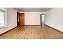 Spacious room boasts gorgeous hardwood floors, a neutral color scheme, and plenty of natural light at 6340 Quay St, Arvada, CO 80003