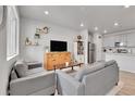 Open-concept living room with views into the kitchen, creating a welcoming and modern space at 6350 N Lisbon St, Aurora, CO 80019
