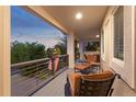 Inviting outdoor porch featuring comfortable seating and attractive railings at 1102 Buffalo Ridge Rd, Castle Pines, CO 80108