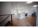 Modern kitchen island with quartz countertops and stainless steel appliances, seamlessly blending with living area at 1552 S Fairplay Way, Aurora, CO 80012