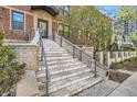 Front entrance featuring stone stairway with railing leading to the main door at 740 N Sherman St # 107, Denver, CO 80203