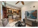 Open concept living room and kitchen with hardwood floors and a ceiling fan at 740 N Sherman St # 107, Denver, CO 80203