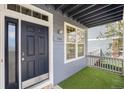 Inviting front entrance featuring a stylish blue door and a well-kept porch at 3542 W 125Th Dr, Broomfield, CO 80020