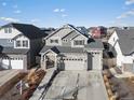 Stunning aerial view of a home with a well-manicured lawn and a spacious driveway at 21901 E 42Nd Place, Aurora, CO 80019