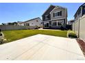 Spacious backyard featuring a well-maintained lawn, patio area, perfect for outdoor entertaining at 21901 E 42Nd Place, Aurora, CO 80019