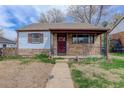 Charming single-story home with a welcoming front porch and a mix of siding materials at 1270 Elmira St, Aurora, CO 80010