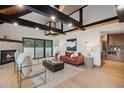 Modern living room with stone fireplace and sliding doors for outdoor access at 1298 Meadow View Dr, Evergreen, CO 80439
