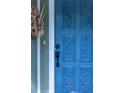 Up-close image displaying a blue, intricately designed front door at 7150 S Curtice St, Littleton, CO 80120