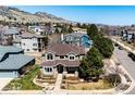 Stunning aerial view of a well-maintained home with mature trees in a peaceful neighborhood with mountain views at 789 Zamia Ave, Boulder, CO 80304