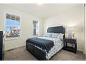 Cozy bedroom with a double bed and ample natural light at 7800 E 148Th Dr, Thornton, CO 80602