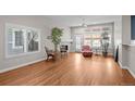 Spacious living room with hardwood floors, fireplace, and lots of natural light at 6900 W Grant Ranch Blvd # 88, Denver, CO 80123