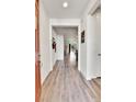 Inviting entryway with attractive wood-look flooring, leading into the open-concept living space at 27862 E 9Th Dr, Aurora, CO 80018