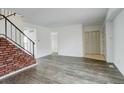 Bright living room with staircase and new floors at 13015 W Ohio Ave, Lakewood, CO 80228