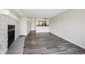 Bright living room with an open floor plan that leads to a modern kitchen at 4273 S Salida Way # 1, Aurora, CO 80013