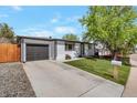 Charming single-story home with well-manicured lawn, long driveway and a one car garage at 251 Norse St, Golden, CO 80401