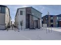 Front view of a two story home with gray and white exterior in winter at 23670 E 41St Ave, Aurora, CO 80019