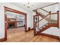 Elegant foyer featuring hardwood floors, grand staircase, and classic trim detailing at 1451 N Gilpin St, Denver, CO 80218