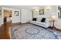 Inviting living room with a comfortable sofa, hardwood floors, and a stylish rug at 2733 S Riverview Dr, Idledale, CO 80453