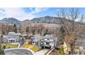 Aerial view of a home nestled in a neighborhood with mountain views at 245 Fair Pl, Boulder, CO 80302