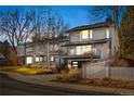 Stunning contemporary home with a white exterior, modern design, and landscaping at 245 Fair Pl, Boulder, CO 80302