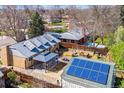 Birds eye view of a home featuring solar panels, a covered patio and a garden area at 1744 S Leyden St, Denver, CO 80224